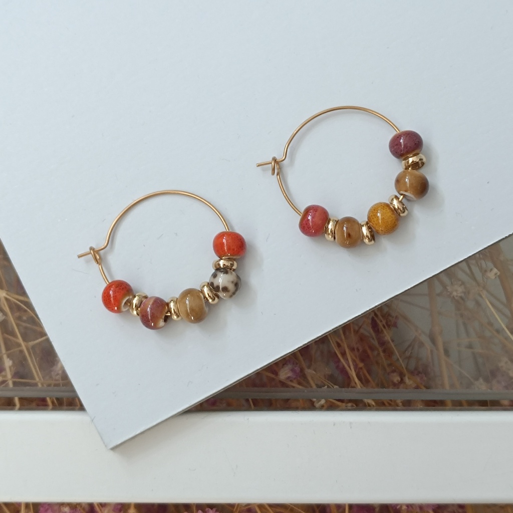 Pendientes Cerámica Carey Asimétricos Dorado